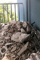 a pile of debris at an apartment interior renovation site in india. debris is then picked and...