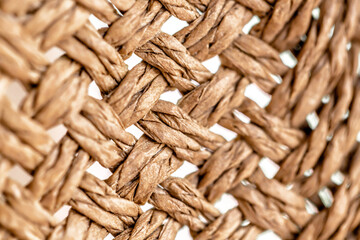 Handmade wooden entwined seats piled up on top of each other. 