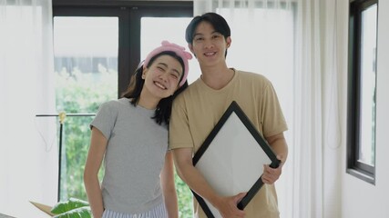 Happy independent couple embracing on moving day, filled with excitement and joy for their new home.