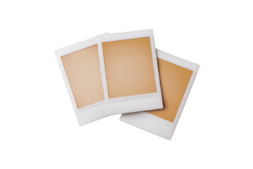 Three white and tan photo frames are stacked on top of each other