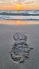 Footstep print on sand during sunset on beach, Preveza, Greece