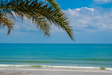 Nature of the ocean and blue sky Summer with sunshine, sandy beaches, clear blue waters sparkling against the blue sky. on an island with good ecology and environment Background for summer vacation