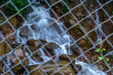 A waterfall during the monsoons near Pune India. Monsoon is the annual rainy season in India from June to September.