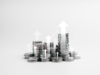 Investment, savings, business finance, stock market trading, economic growth concept. Many arrows rise up from silver money coin stack groups with green and red candlesticks on white background.