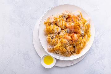 Raw chicken wings, with dry rub and olive oil prepared for bbq