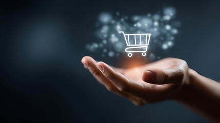 Digital shopping cart floating above open hand with glowing light and bokeh effect in dark background