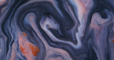 Pour paint. Splash fluid. Defocused purple pink orange colorful bright sparkling wet flow pigment...