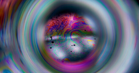 Bubble defocused planet. Ink spill. Neon color fluid mix glowing sphere. Cosmic globe gasoline...