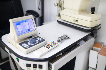 Close up of professional eye testing equipment. Modern eye testing device standing in the lab....