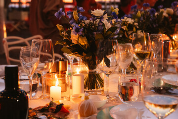 Elegant Candlelit Dinner Table Setting with Flowers