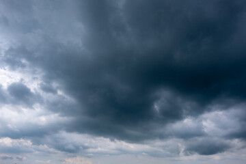 Obraz premium Dark sky with stormy clouds. Dramatic sky rain,Dark clouds before a thunder-storm,clouds before rain