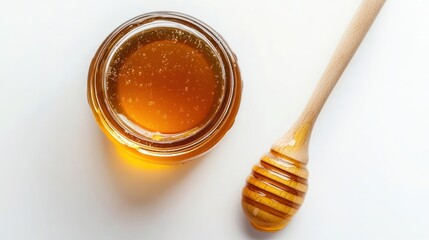 Honey in a jar with a dipper
