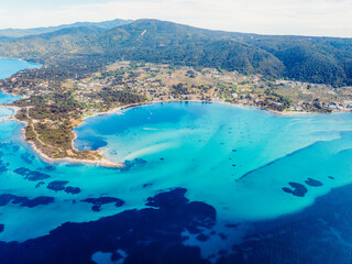 Obraz premium Seacoast with shades of turquoise water with beaches and blue lagoons in Karidi in Sithonia Peninsula, Vourvourou bay, Halkidiki, North Greece