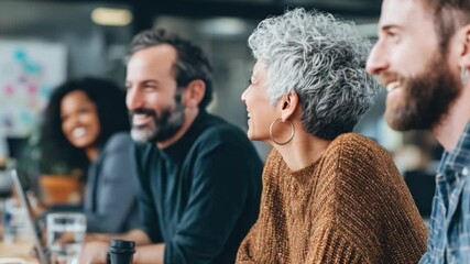 Collaborative Spirit at Work: A diverse group of colleagues, engaged in a lively meeting, fosters a sense of collaboration and focused discussion, creating an atmosphere of productivity.