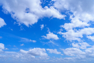 Cloudy blue sky on sunny day.