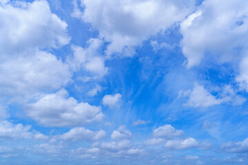 Cloudy blue sky on sunny day.