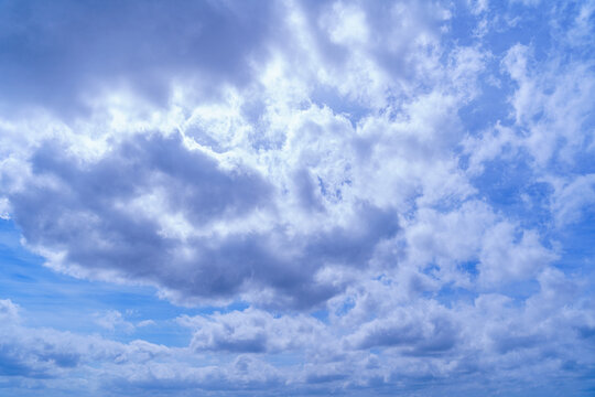 Cloudy blue sky on sunny day.
