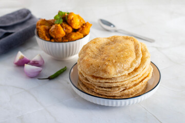 Radha Ballavi is a stuffed Bengali puri filled with spiced lentils, served hot with flavorful alur...