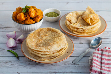 Radha Ballavi is a stuffed Bengali puri filled with spiced lentils, served hot with flavorful alur...