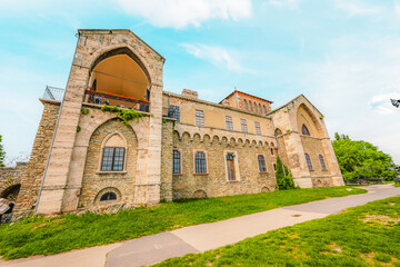 Fototapeta premium Old stone Tata Castle - 14th-century castle and museum with restored rooms and garden in Tata town, Hungary
