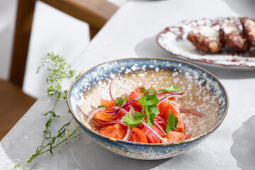 Tomato and red onion salad, bright natural lighting, rustic overhead composition