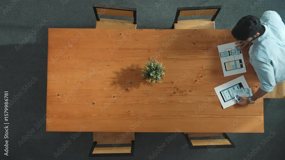 Poster top down view of business man prepare financial document for meeting while walking at table with col