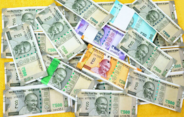 piles of new indian currency notes rupees 50,100,200 and 500