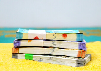 Indian currency Bundles of 50, 100, 200 or 500 rupee notes arranged in a row