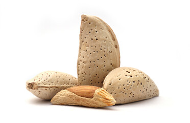 A small group of whole raw almonds in shells, a healthy and nutritious snack food.