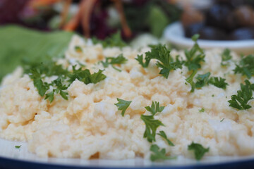scrambled egg topped with fresh herbs and vegetables