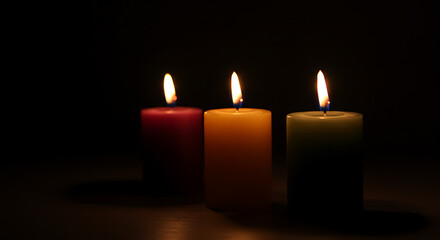 Cozy Scene with Three Lit Candles at Night