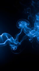 The smoke is illuminated with soft, fostering an air of intrigue blue smoke against a dark background. A shadowy space shrouded in blue haze
