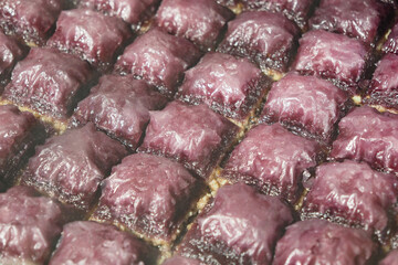 Baklava on display at a bustling market in autumn