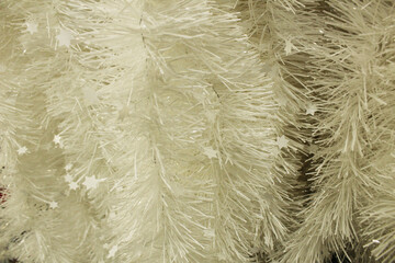 White Christmas New Year background. Decorative tinsel close-up