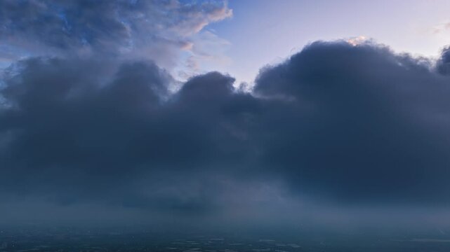 Time lapse of heavenly clouds with beautiful golden light shining from within at sunrise.