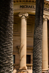 A contrast between manmade fluted columns and nature made palm tree trunks_20101218_05601