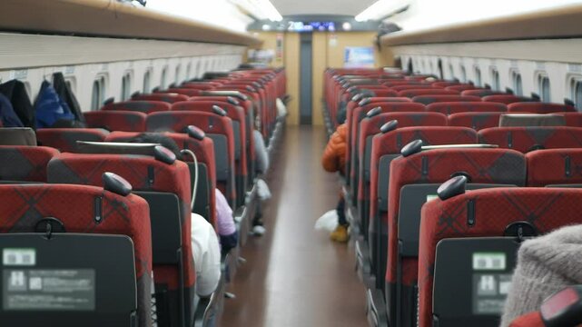 interior view inside Highspeed bullet train full with passenger sitting in train commuters while train moving running in high speed,japan public train transportation from inside