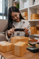 she in an entrepreneur, she sells product online, she own a small business that sell product online, sme, a lot of parcel stack in the room, working in her shopping online storage