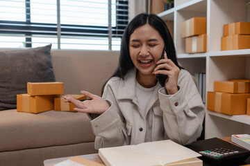 this businesswoman own a small business, sme, she is working in online business to sell her product, a lot of parcel, package, an entrepreneur is working on the parcel before deliver to customer
