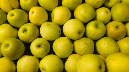 background yellow green apples in a market for sale