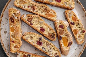 Italian Almond Biscotti biscuits in a rustic home made pottery bowl. Studded with almonds and...