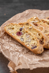Italian Almond Biscotti biscuits in a rustic home made pottery bowl. Studded with almonds and...