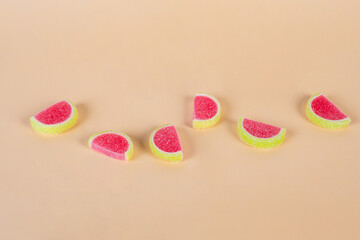 Fruit jelly mixed with sugar on cream background