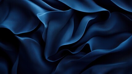 Fototapeta premium Deep blue fabric drapes in elegant folds.