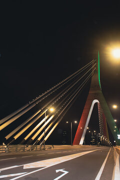 Night side view of the Alassane Ouattara Bridge in Abidjan &ndash; Modern architecture illuminated