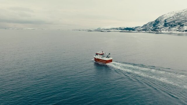 Fishing Vessel Navigating In The Fjord Near Lodingen In Nordland, Norway. - aerial shot
