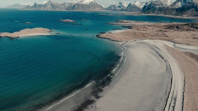 Sandy Shore Of Yttersand Beach By The Blue Sea In Fredvang, Norway. - aerial shot