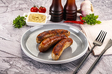 Delicous natural roasted sausages in the plate