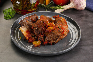 Baked beef ribs with vegetables