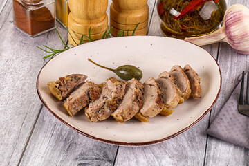 Roasted duck breast slices in the plate